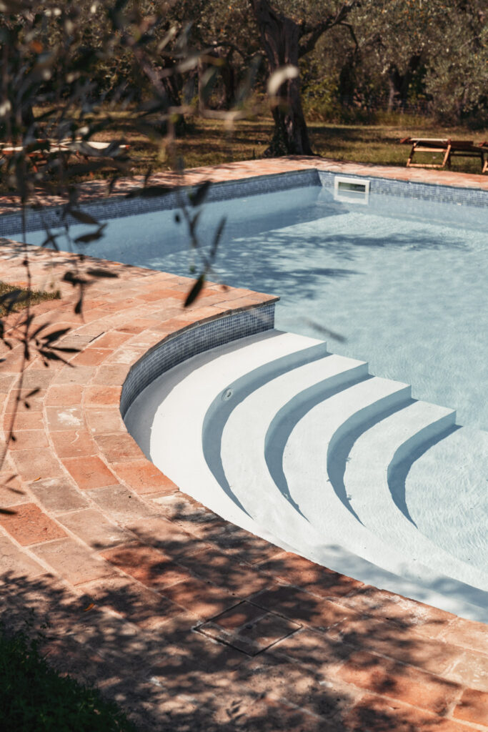 Pignocco pool with wide steps gently leading into the water.